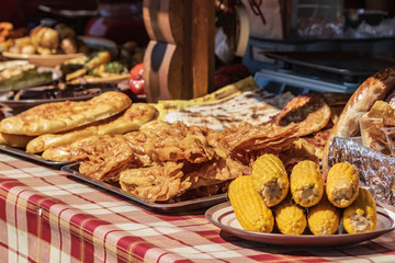Culinary buffet with a presentation of a variety of healthy food - meat, sausage, grilled vegetables. Kitchen in the open air.