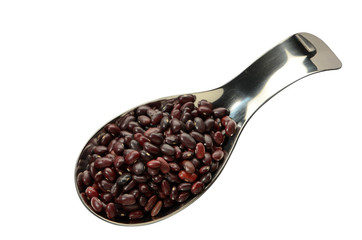 Red beans in a spoon on an isolated background top view.
