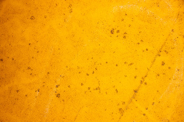 Yellow grunge painted wall texture