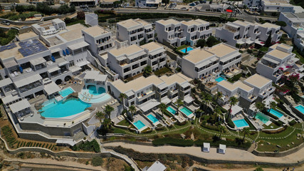 Aerial panoramic photo of famous turquoise clear sea celebrity sandy beach and bay of Psarou with...