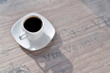 white coffee cup, morning side light background old port oak close-up