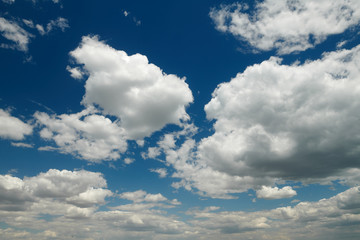 Bright beautiful blue sky with clouds for background or texture