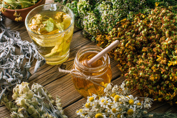 Harvesting herbs, flower tea and honey, alternative medicine