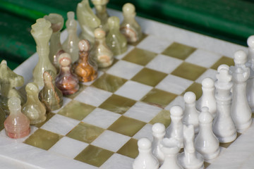 Chess pieces placed on the board. Beginning of the game. World Chess Day.