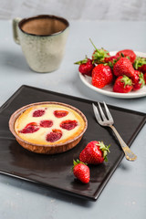 strawberry berry pie with a Cup of coffee on a light background