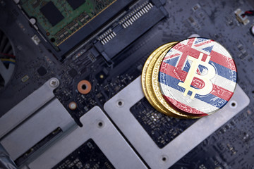 golden bitcoins with flag of hawaii state on a computer electronic circuit board. bitcoin mining...