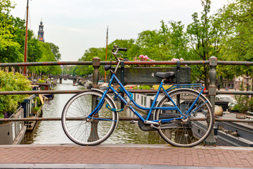 Fototapeta na wymiar Bicycle on Amsterdam Canal Bridge 