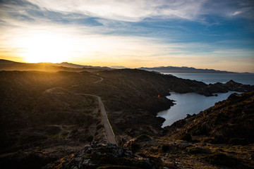 Sunset and a curved road view in Cap de Creus, Catalunya