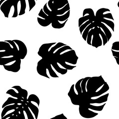 Vector seamless pattern from silhouette of monstera leaves