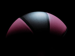 Magenta and black modern basketball ball for men or women on black background.