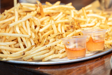 Large serving of string french fries with an aioli dip