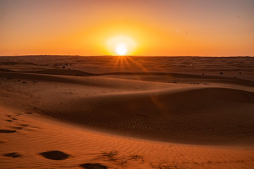 Sunset in the Wahiba Sands desert in Oman
