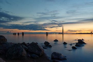 White nights skyscraper view with rocks