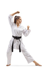 Woman with black belt and kimono practicing karate kata © Ljupco Smokovski