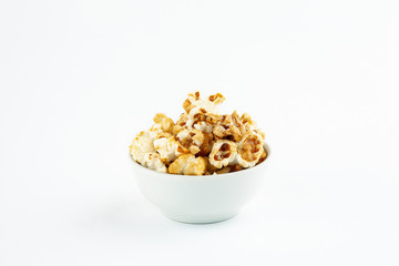 Sweet popcorn in ceramic bowl on white background