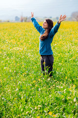 The happy woman with yellow flowers.