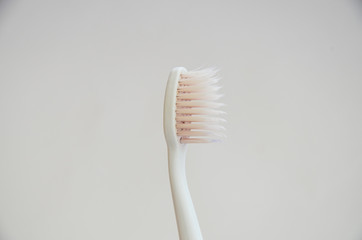 Bath accessories, toothbrush, razor, soap and soap dish, washcloth on a white background