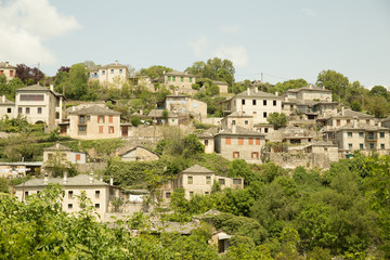 Fototapeta na wymiar Ioannina village Vitsa in spring season old tranditional houses and green trees