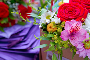 Bouquet of multicolored roses . Red flower picture close up in the bouquet. Bouquet of fresh red, white , purple roses .