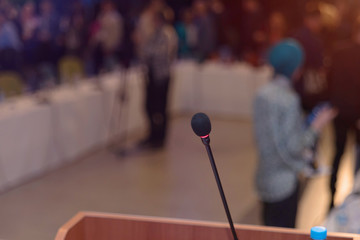 Front view of the microphones during business conference in conference room or hall, panel duscusion of economic development