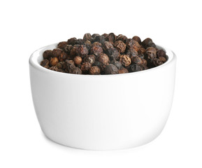 Bowl of black peppercorns isolated on white