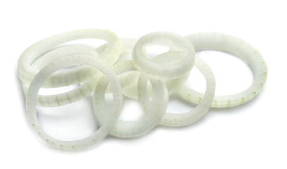 Fresh raw onion rings on white background