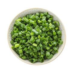 Bowl of cut green onion on white background, top view