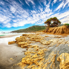 Fantastic view of Capo Carbonara beach with turquoise water and rocks