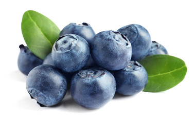 Fresh raw tasty blueberries with leaves isolated on white
