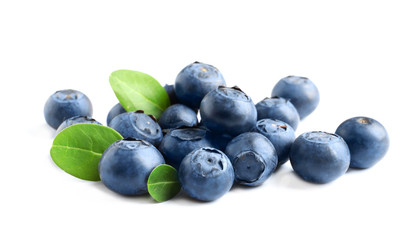 Fresh raw tasty blueberries with leaves isolated on white