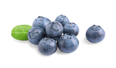 Fresh raw tasty blueberries with leaf isolated on white