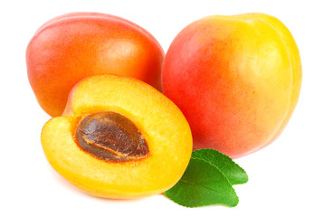 apricot fruits with slices and green leaf isolated on white background