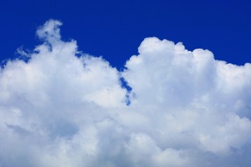 Naklejka na ściany i meble beautiful white clouds on blue sky on a sunny day