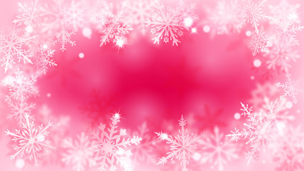 Christmas blurred background with frame of complex defocused big and small snowflakes in red and pink colors with bokeh effect