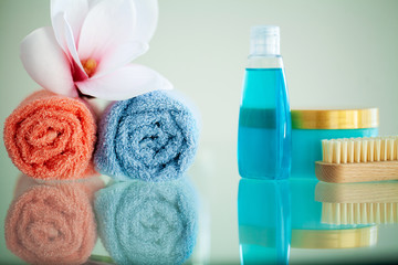 Colored towels on white table with copy space on bath room background