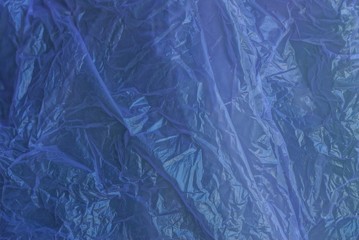 lilac dark plastic texture from a crumpled piece of old cellophane