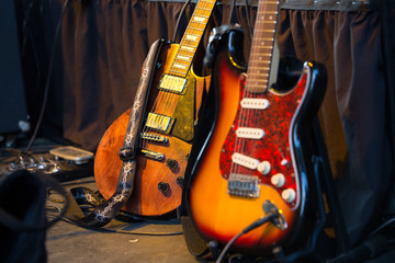 Two classic electric guitars ready to be played in a music studio. Musical Instrument. Concept:...