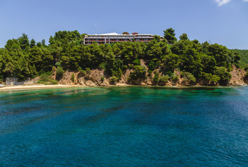 Landscape view to Skiathos island from the sea. Old bildings of town. Greece