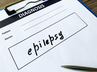 Diagnosis epilepsy in a medical form on the doctor desk