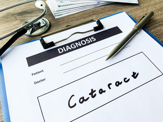 Diagnosis cataract in a medical form on the doctor desk