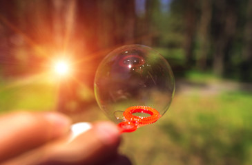 soap bubbles into the sunset with beautiful bokeh.close-up