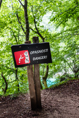 Danger, Opasnost, sign warning of falling from high cliff in the Plitvice Lakes national park Croatia