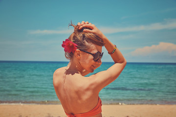 Beautiful woman enjoying on the tropical beach.