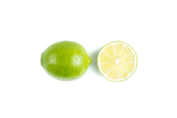Whole and half of lime isolated on white background