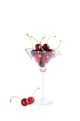 Cherry in a glass isolated on a white background