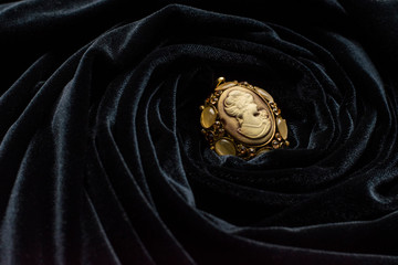 Bronze livory brooch in black veil cloth