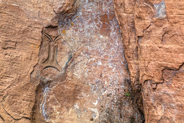 Urubici, Santa Catarina, Brazil - January 28, 2019: Rocks that refer to prehistory present inscriptions of primitive masks.