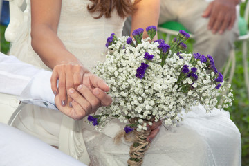 Wedding day bride and Groom showing their love in an outdoor wedding. In love concept. Newly weds happy couple celebrating love. Happily ever after. Latin American people marriage ceremony.