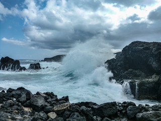 waves crashing on rocks
