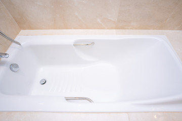 big white bathtub in shower room